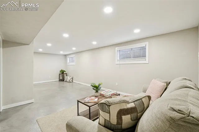 a living room with furniture and a table