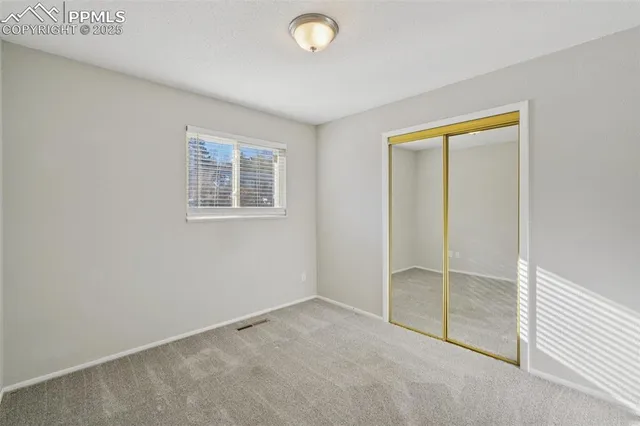 a view of storage and utility room with empty racks
