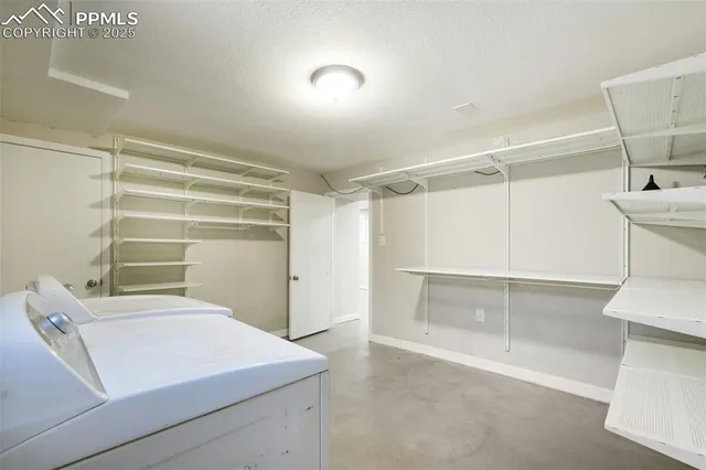 a bathroom with a toilet a sink and shower