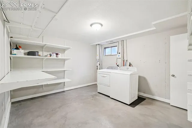 a bathroom with a sink a potted plant and a shower