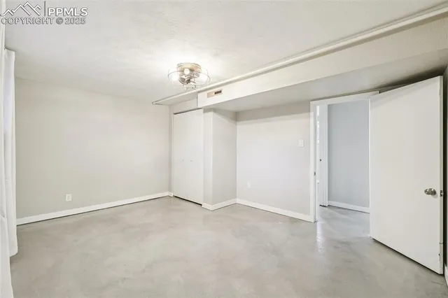 an empty room with a mirror