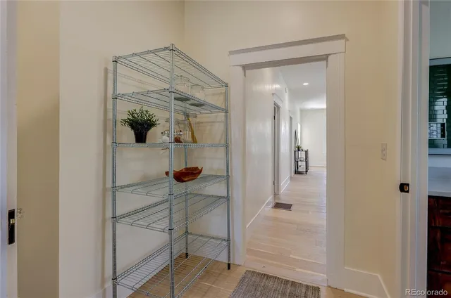 a bathroom with a glass shower door and a mirror