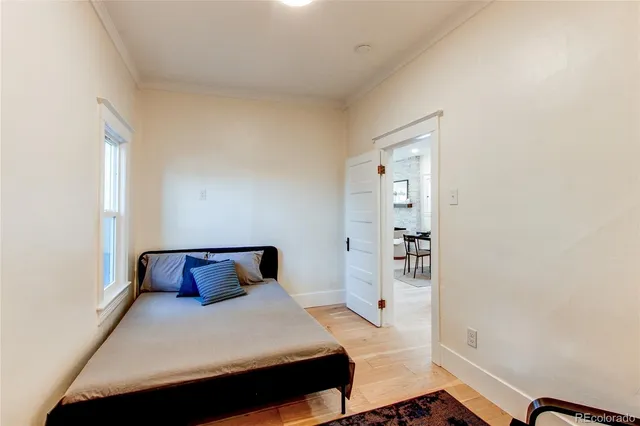 a bedroom with a bed and cabinets