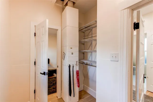 a view of closet with wooden floor