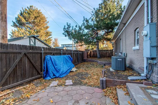 a view of a backyard with table and chairs