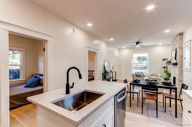 a kitchen with a table and chairs in it