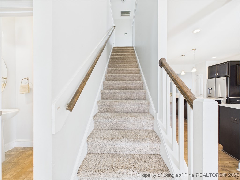 3149 Hunting Lodge Road Fayetteville, NC 28306 - Photo 15 of 49 a view of staircase with white walls