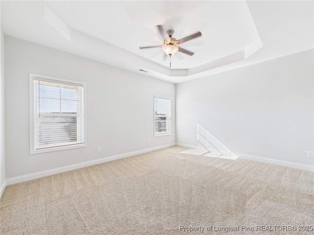 3149 Hunting Lodge Road Fayetteville, NC 28306 - Photo 16 of 49 an empty room with windows and fan