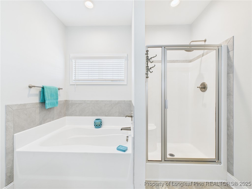 3149 Hunting Lodge Road Fayetteville, NC 28306 - Photo 22 of 49 a bathroom with a shower and a sink
