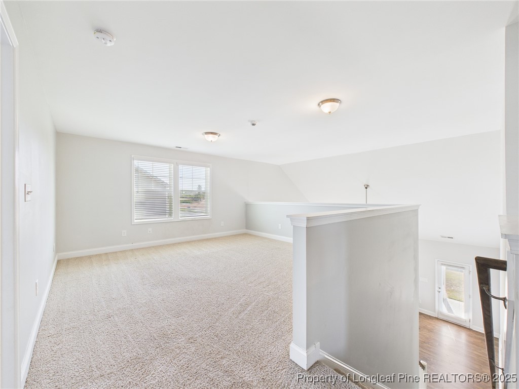 3149 Hunting Lodge Road Fayetteville, NC 28306 - Photo 25 of 49 a view of an empty room with wooden floor and a window