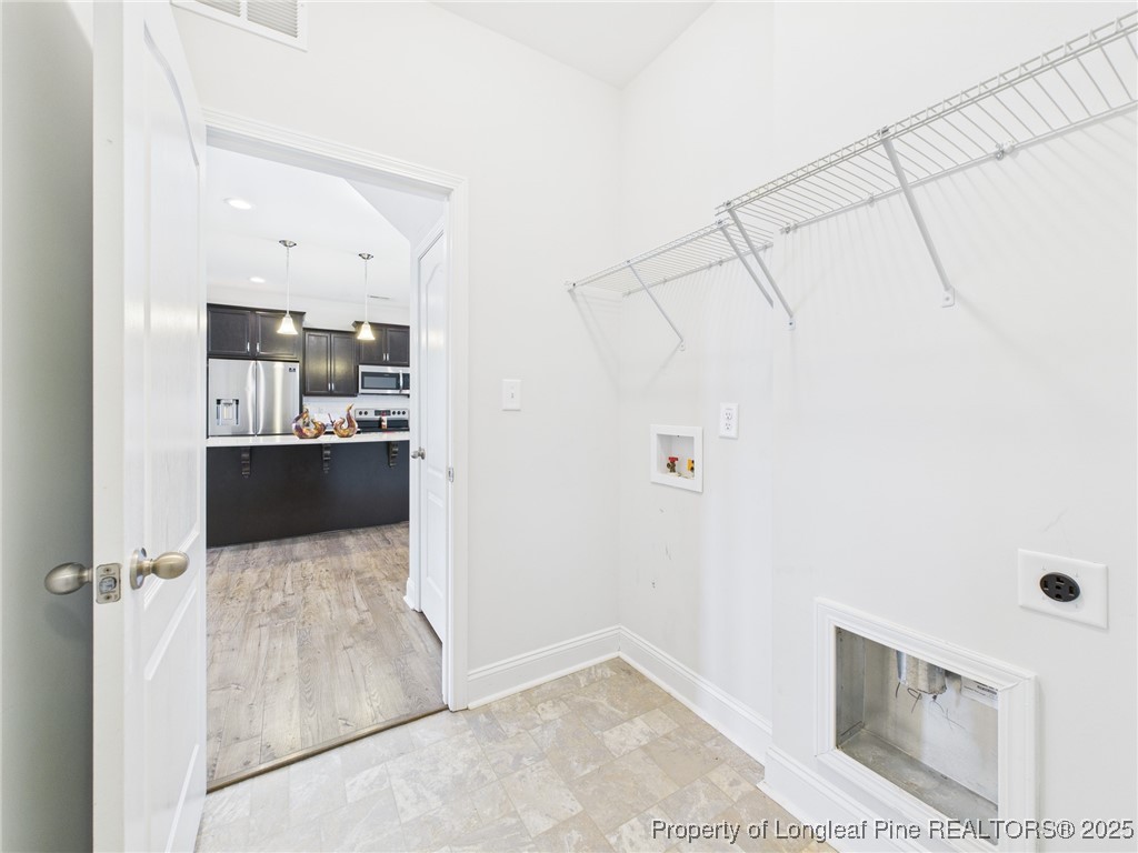 3149 Hunting Lodge Road Fayetteville, NC 28306 - Photo 43 of 49 a kitchen with kitchen island a counter top space and appliances