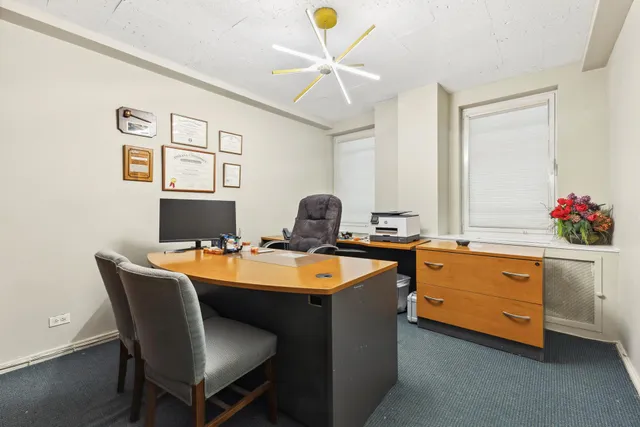 a dining room with furniture and chandelier