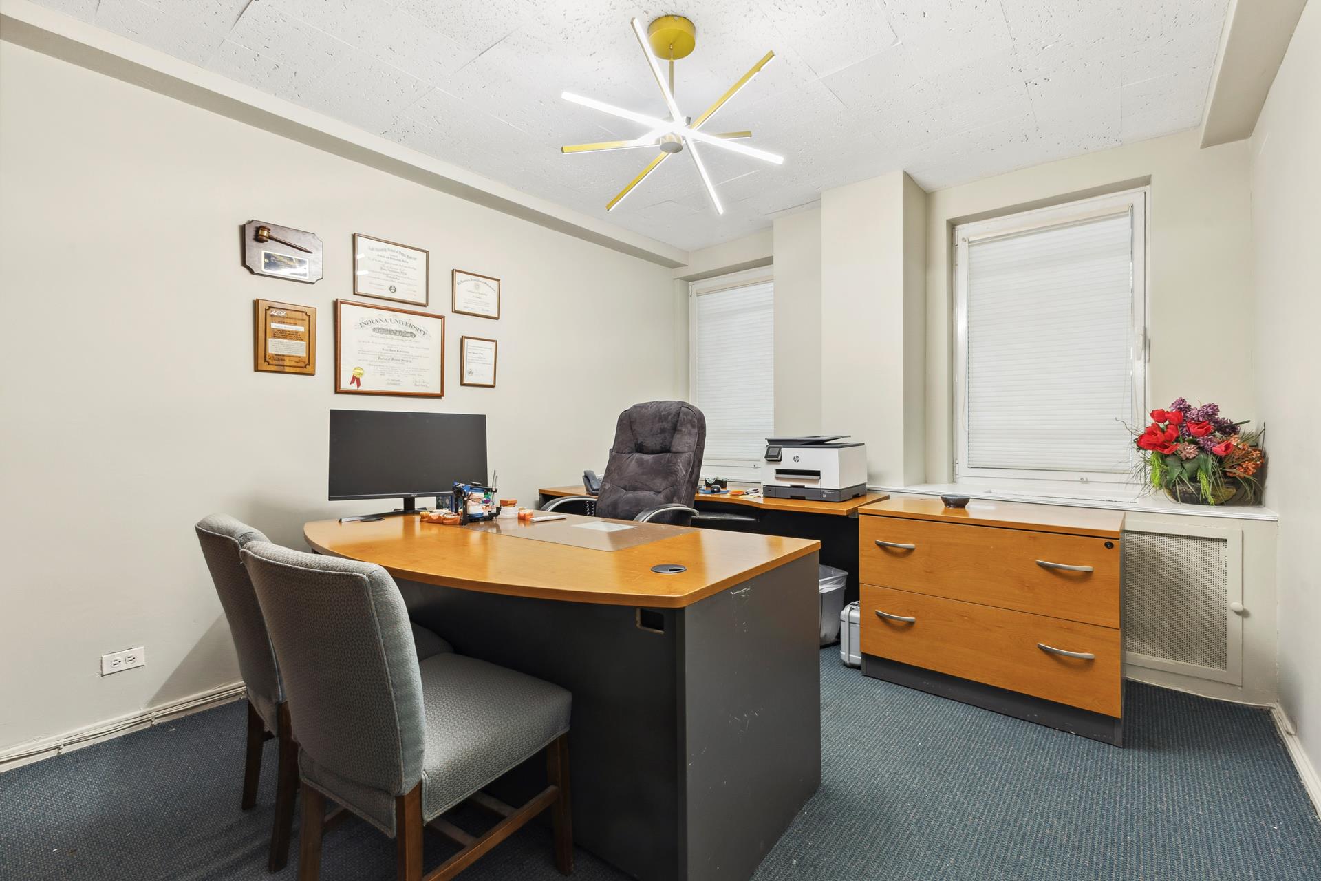 880 5th Avenue, Unit 1J Manhattan, NY 10021 - Photo 1 of 12 a dining room with furniture and chandelier