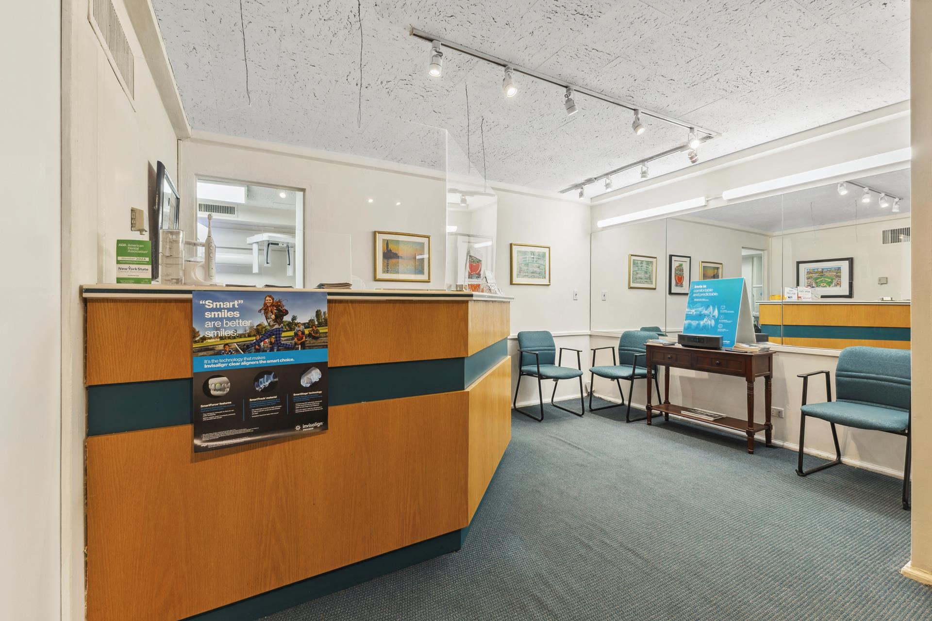 880 5th Avenue, Unit 1J Manhattan, NY 10021 - Photo 2 of 12 a living room with furniture and a dining table with wooden floor