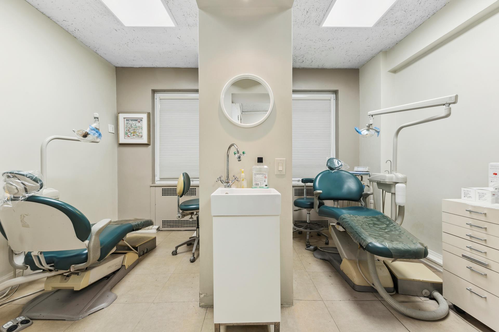 880 5th Avenue, Unit 1J Manhattan, NY 10021 - Photo 3 of 12 a room with gym equipment and a mirror