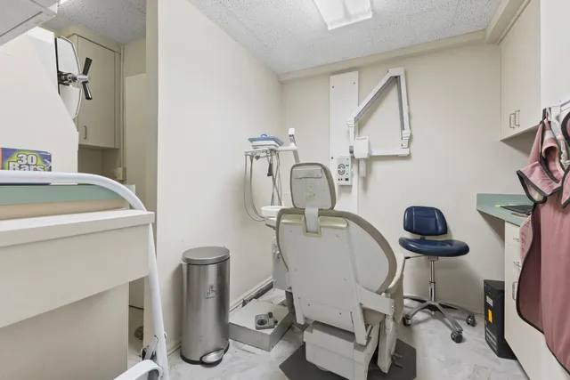 a room with gym equipment and a mirror