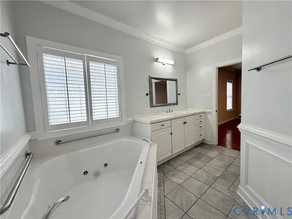 a view of an empty room and wooden floor