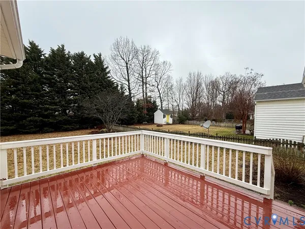 a view of outdoor space with wooden fence