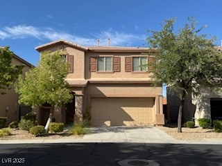 8870 South Carradori Avenue Las Vegas, NV 89148 - Photo 1 of 14 View of front of house with stucco siding, driveway, and an attached garage