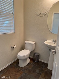 8870 South Carradori Avenue Las Vegas, NV 89148 - Photo 13 of 14 Half bath with a textured wall and toilet