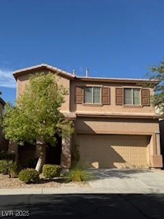 8870 South Carradori Avenue Las Vegas, NV 89148 - Photo 14 of 14 View of front facade with a garage, concrete driveway, and stucco siding