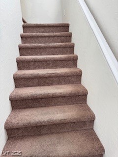 8870 South Carradori Avenue Las Vegas, NV 89148 - Photo 8 of 14 Staircase featuring carpet floors