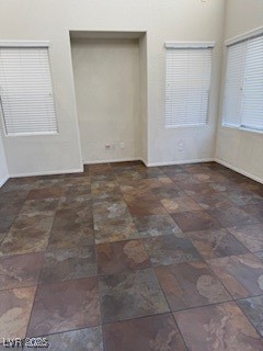 8870 South Carradori Avenue Las Vegas, NV 89148 - Photo 9 of 14 Empty room featuring baseboards