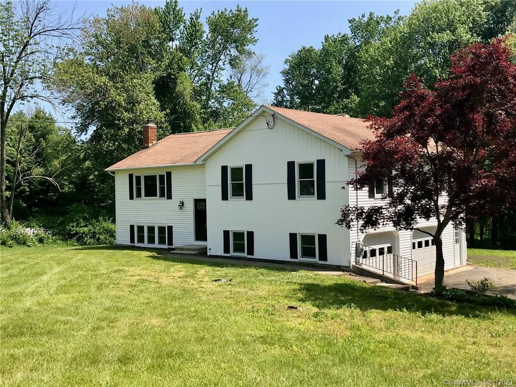 a view of a house with a yard patio and a patio
