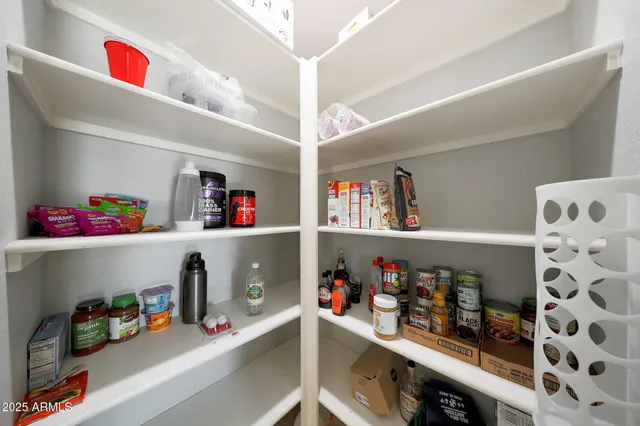 a room with lots of storage and a sink