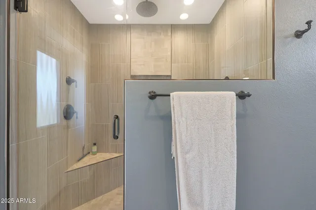 a bathroom with a bathtub and shower