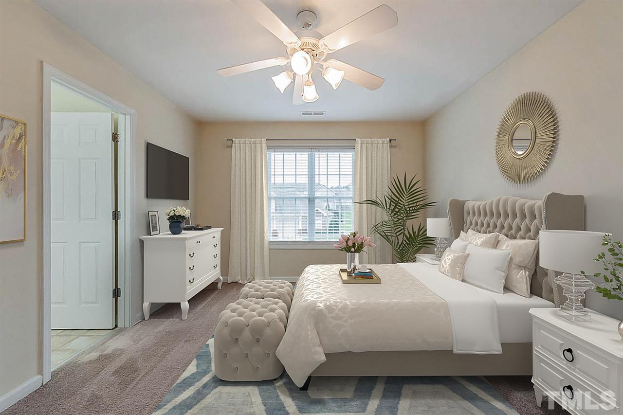 2608 Andover Glen Road Raleigh, NC 27604 - Photo 2 of 19 a bedroom with a large bed and a window