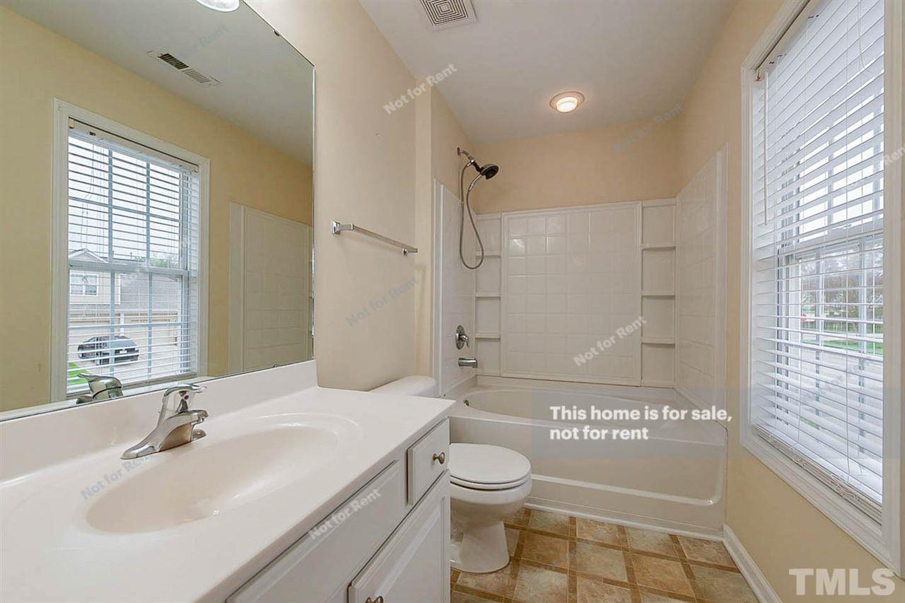 2608 Andover Glen Road Raleigh, NC 27604 - Photo 14 of 19 a bathroom with a sink a toilet and shower