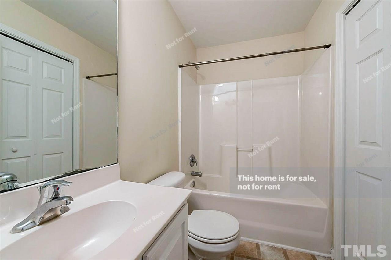 2608 Andover Glen Road Raleigh, NC 27604 - Photo 16 of 19 a bathroom with a sink a toilet and shower