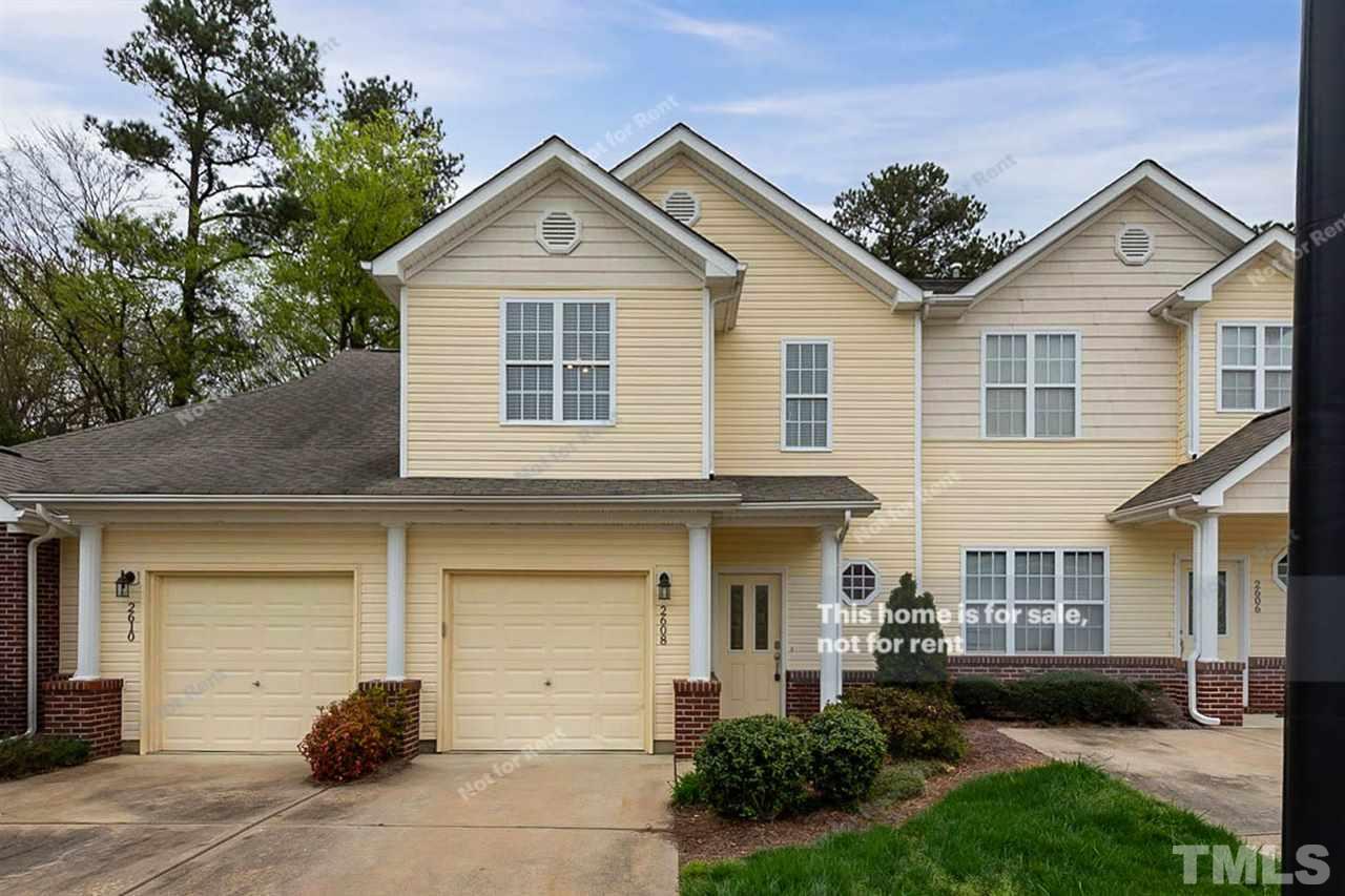 2608 Andover Glen Road Raleigh, NC 27604 - Photo 3 of 19 a front view of a house with a yard and garage