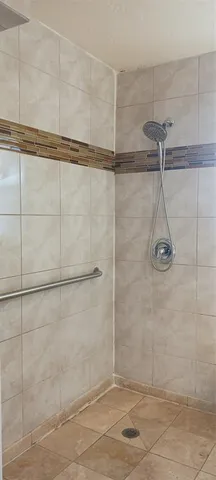 a view of a garden with a chair and a potted plant