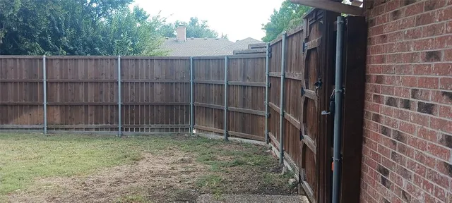 a backyard of a house with yard and garage