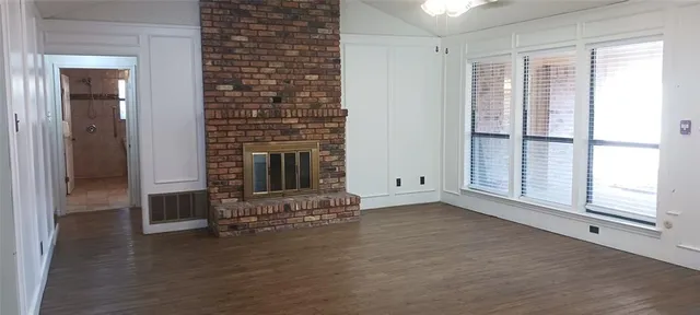 a kitchen with cabinets appliances and a window