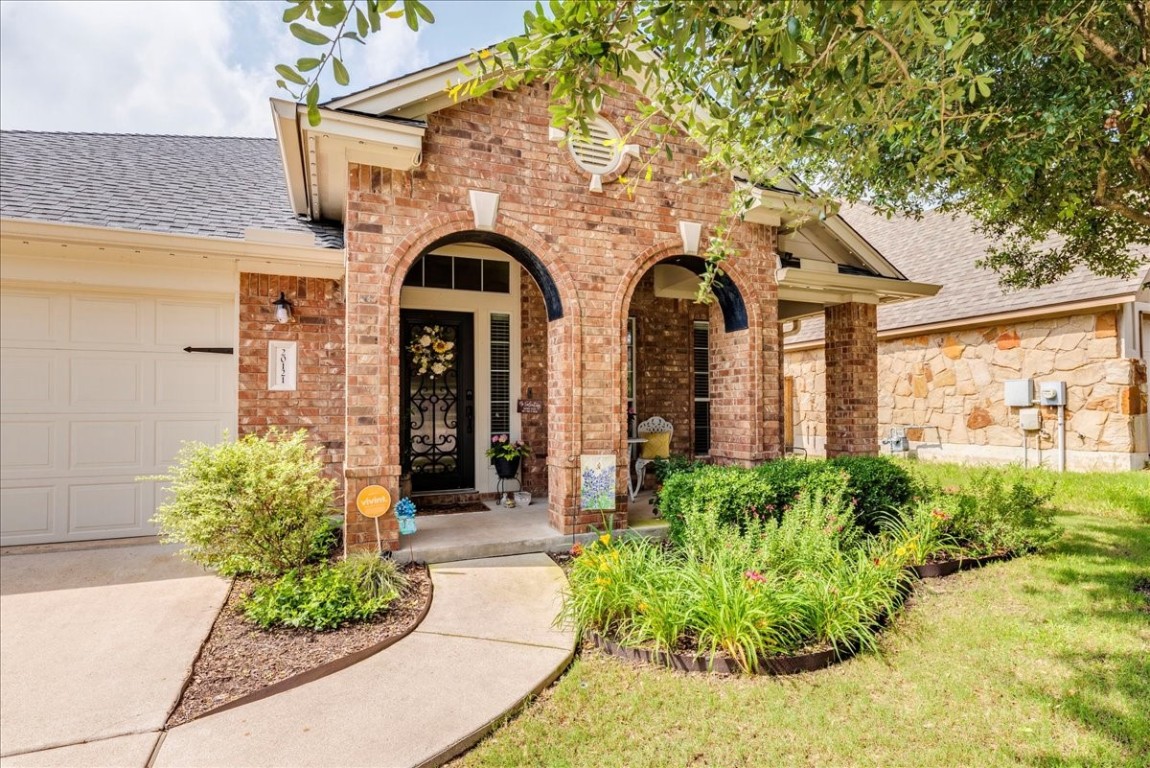 20121 Wearyall Hill Lane - great curb appeal with landscaped flowerbeds, cozy front porch, and architectural arches.