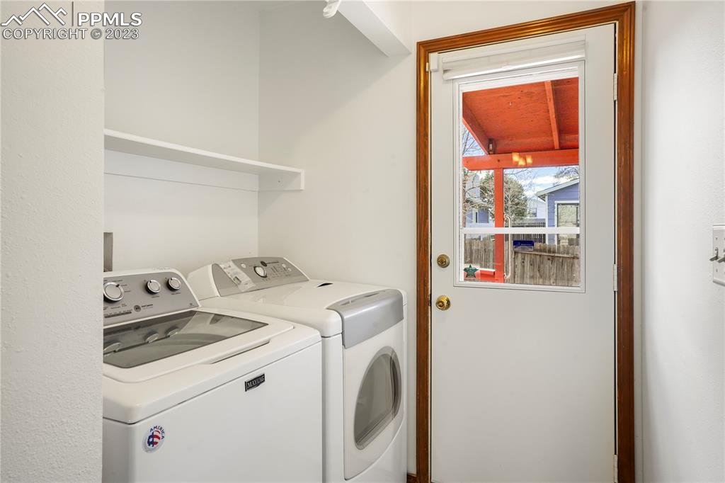 6385 Bismark Road Colorado Springs, CO 80922 - Photo 11 of 25 a utility room with dryer and washer