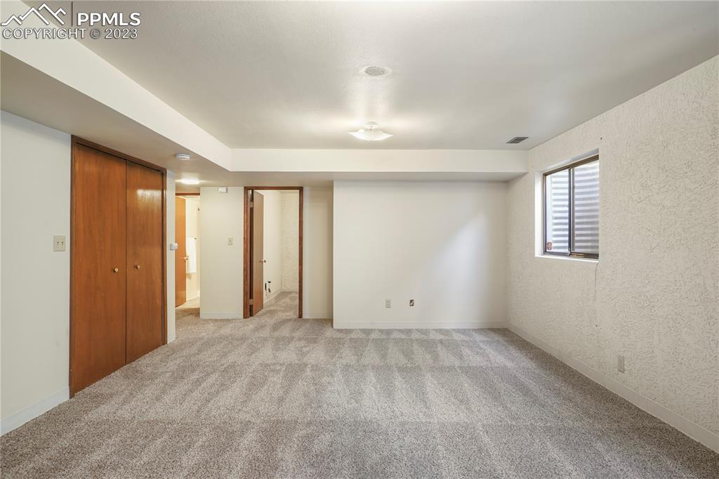 6385 Bismark Road Colorado Springs, CO 80922 - Photo 14 of 25 a view of an empty room with a window