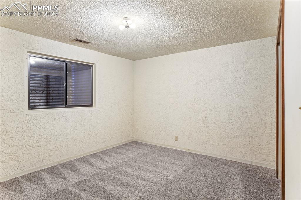 6385 Bismark Road Colorado Springs, CO 80922 - Photo 16 of 25 an empty room with a window