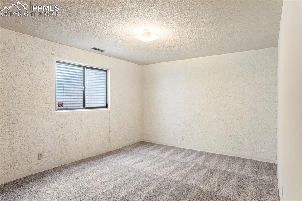 6385 Bismark Road Colorado Springs, CO 80922 - Photo 18 of 25 an empty room with a window