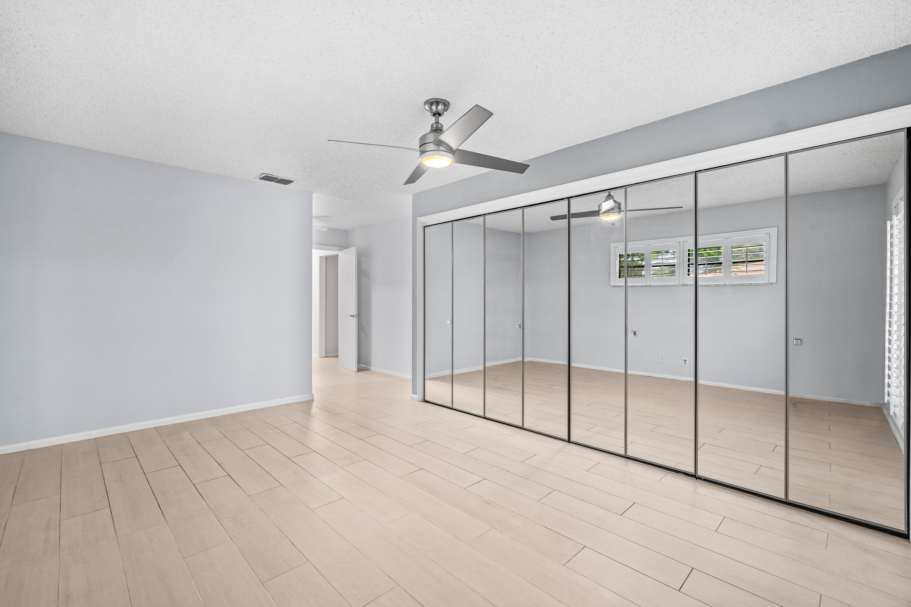 4897 Hawkwood Road, Unit A Boynton Beach, FL 33436 - Photo 12 of 25 Master Bedroom with Wall Closets