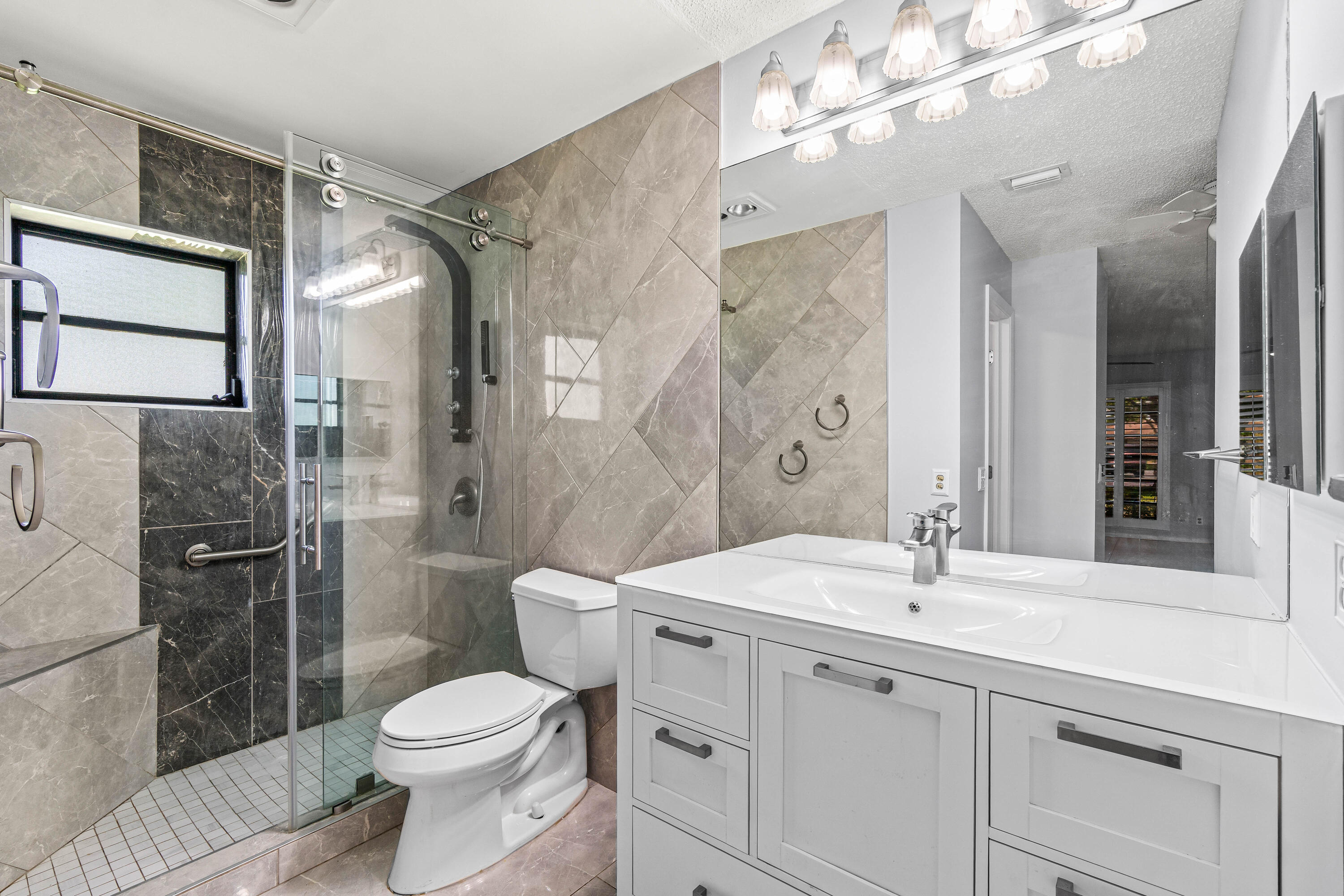 4897 Hawkwood Road, Unit A Boynton Beach, FL 33436 - Photo 14 of 25 Master Bathroom