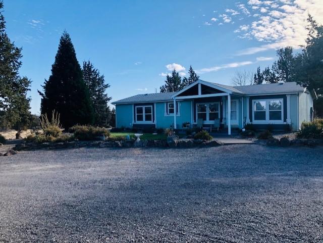9620 Northwest Rocky Road Powell Butte, OR 97753 - Photo 1 of 21 front
