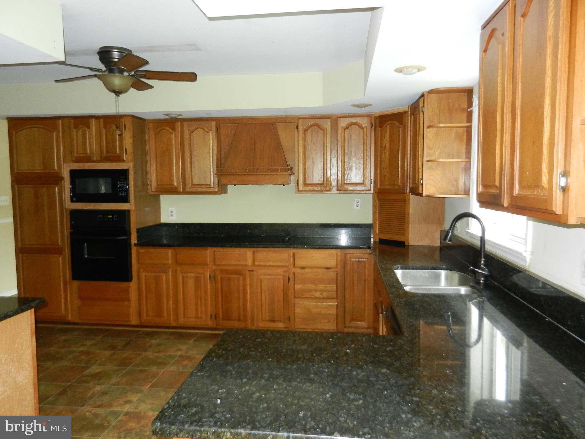 9801 Old Court Road Baltimore, MD 21244 - Photo 5 of 21 Large kitchen with cooktop, oven and microwave