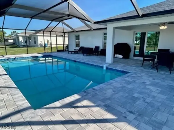 a view of a swimming pool with a patio