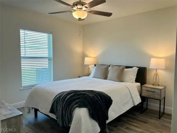 a bathroom with a granite countertop sink toilet and a shower