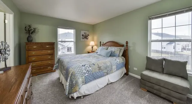 a bedroom with a bed and a couch