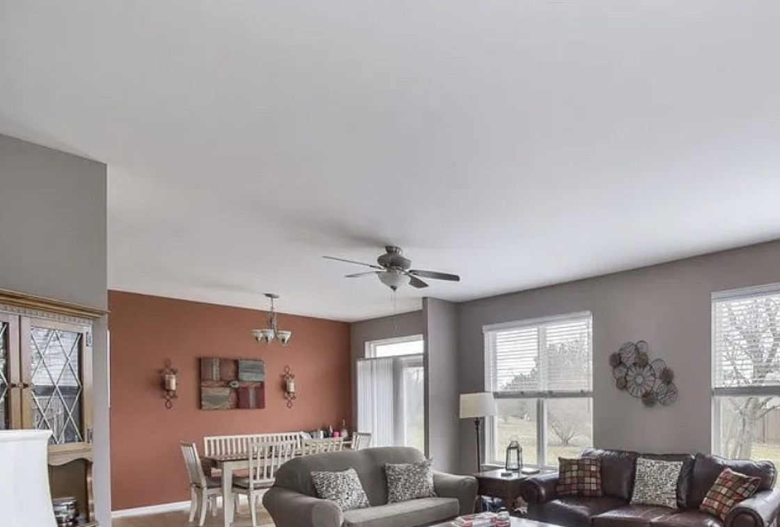 2221 Sunrise Circle, Unit 2221 Aurora, IL 60503 - Photo 4 of 15 a living room with furniture and a large window